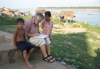 Paul Geerts, tekenend in Cambodja.